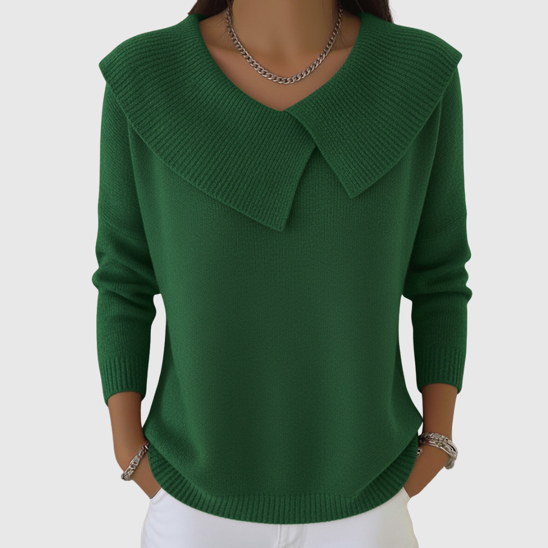 A woman wearing a soft collared jumper styled elegantly for a festive occasion.