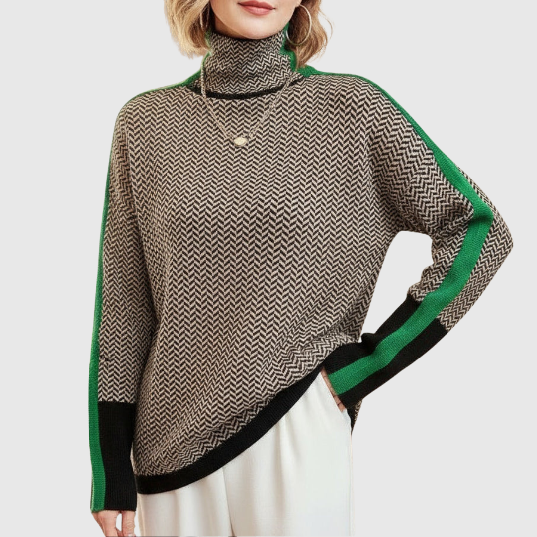 A woman wearing a brown and beige chevron high-collar jumper with bright green side stripes.