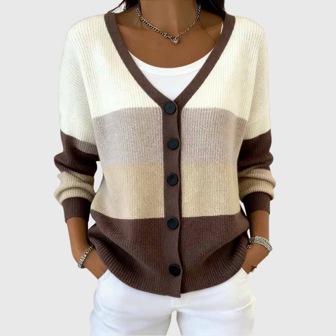 A woman wearing a soft button cardigan open over a top on a cool spring morning.