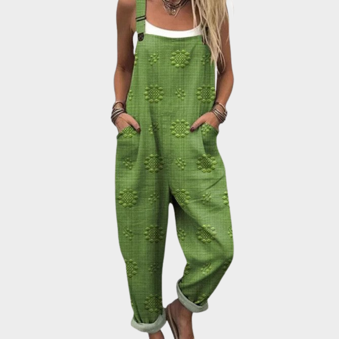 Woman wearing fresh grass green textured dungarees with adjustable straps, relaxed and natural.
