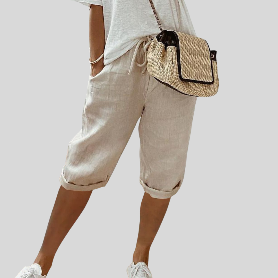 Wide-leg high-waist trousers in a neutral beige tone