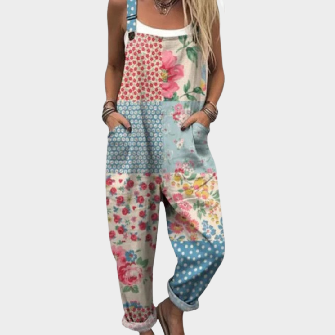 Woman wearing pastel boho patchwork dungarees with flowers, dots and checks, adjustable straps, cheerful and relaxed.