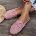 Women's slip-on loafers with a small bow detail in a soft neutral tone