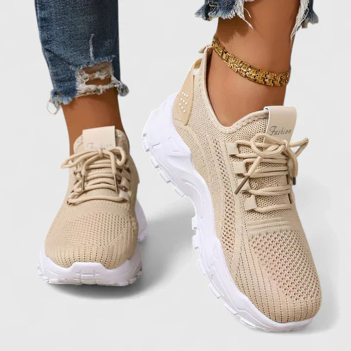 A woman wearing wide-toe cushioned orthopaedic trainers