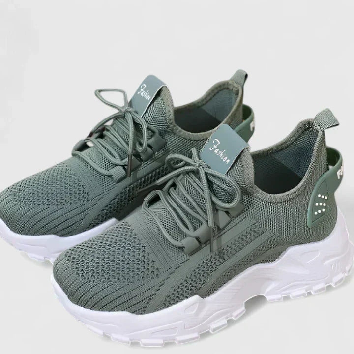 A woman wearing wide-toe cushioned orthopaedic trainers