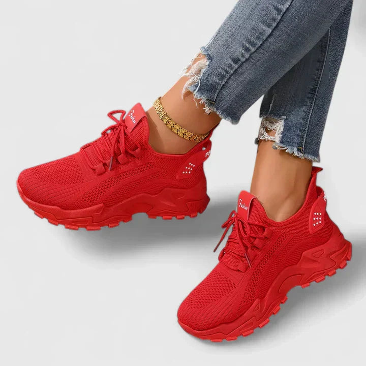 A woman wearing wide-toe cushioned orthopaedic trainers