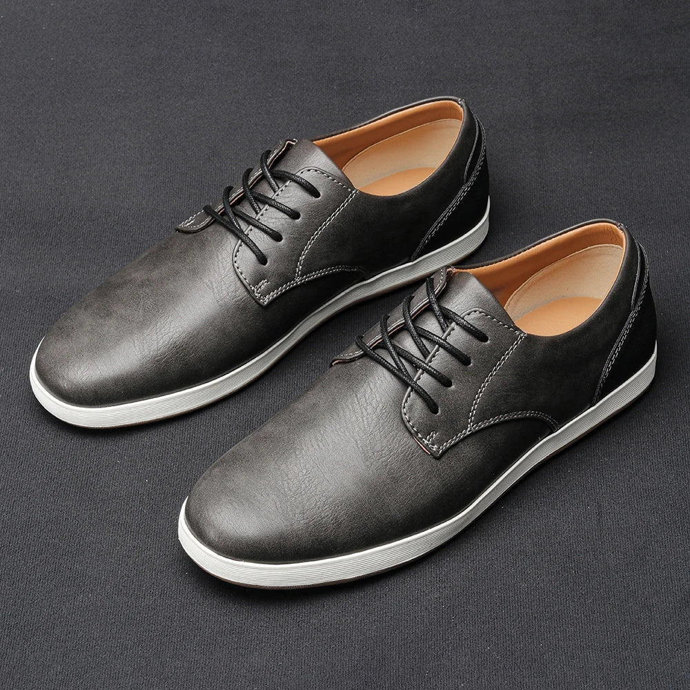 Men's light tan smart casual trainers with a smooth refined upper and clean low-profile sole