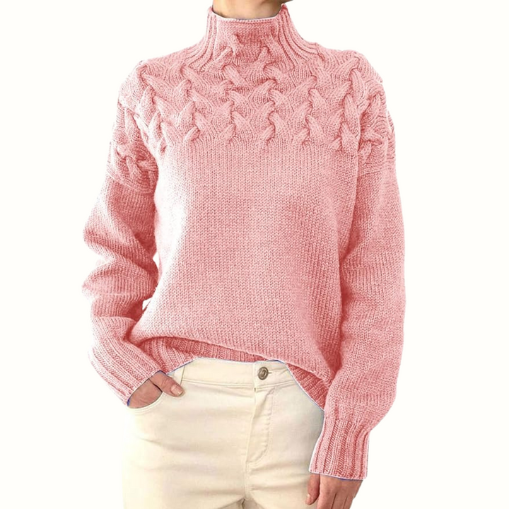 A woman wearing a warm roll-neck jumper, cosy and elegant on a cold winter day.