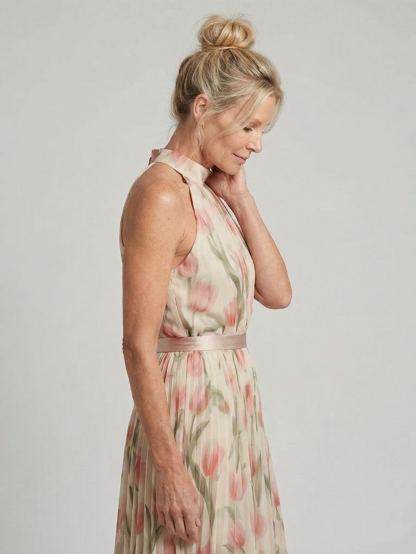 Floral halter-neck midi dress with defined belt waist and flowing relaxed skirt