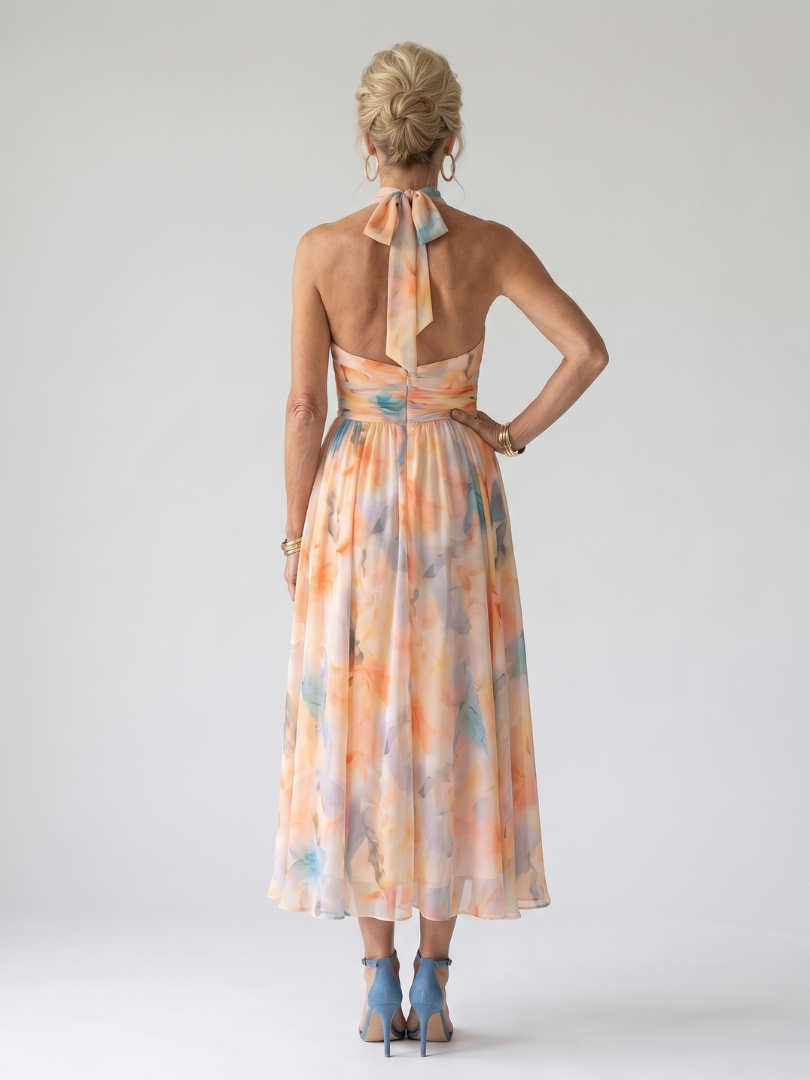 Multicolour halter-neck midi dress with ruched neckline, defined waist and flowing skirt