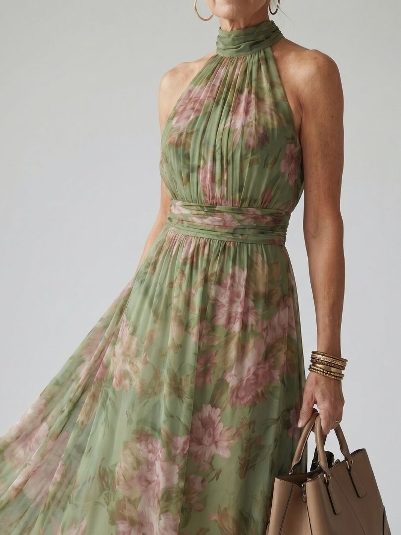 Sage green floral halter-neck midi dress with ruched neckline and flowing skirt