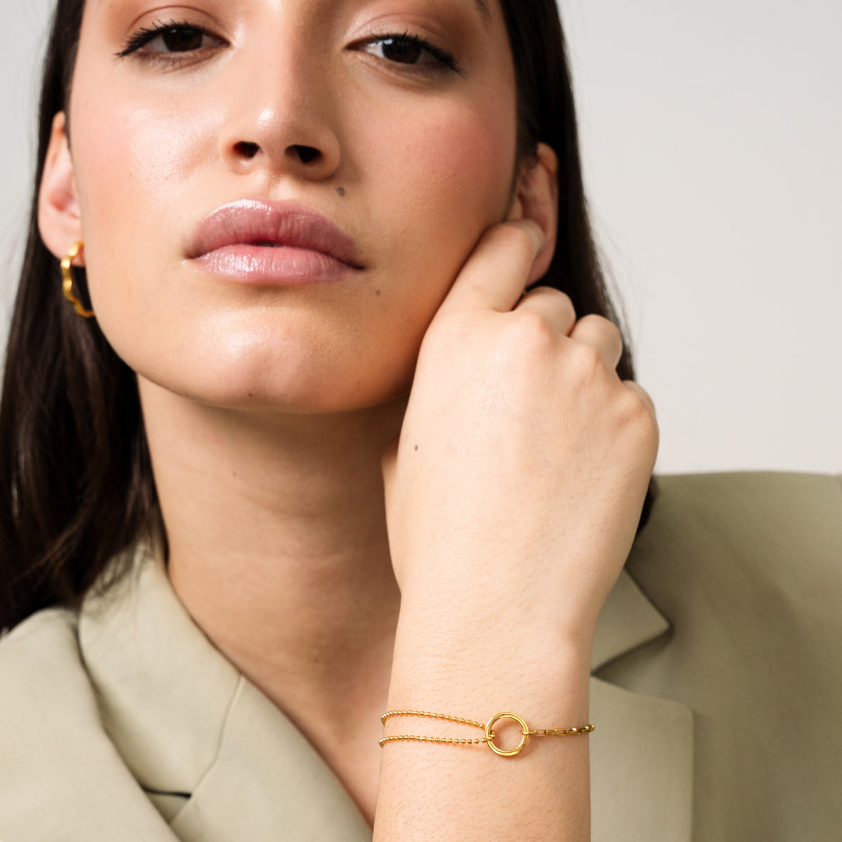 Elegant gold tennis bracelet with row of sparkling stones
