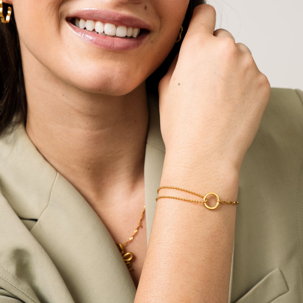 Elegant gold tennis bracelet with row of sparkling stones