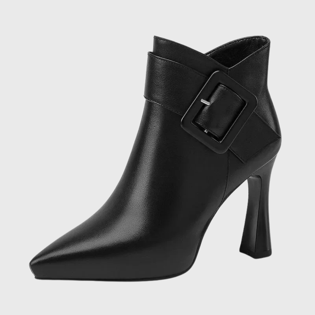 Sleek heeled ankle boots in beige and black with a side zip and structured silhouette