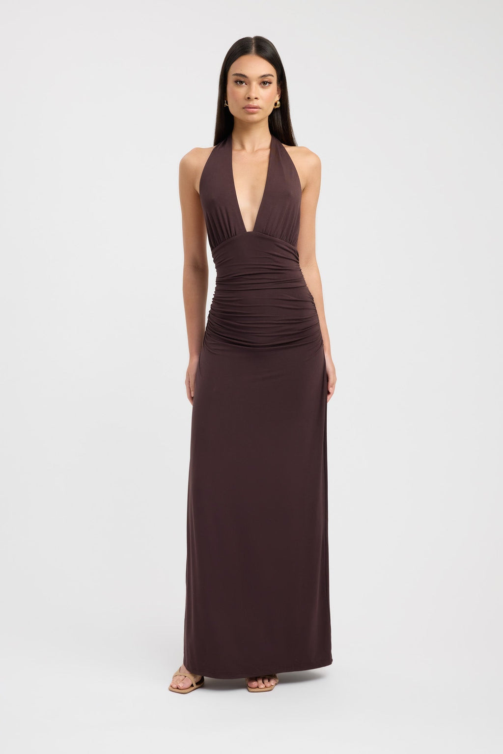 Floor-length dark brown occasion dress with a refined button neckline and fluid silhouette