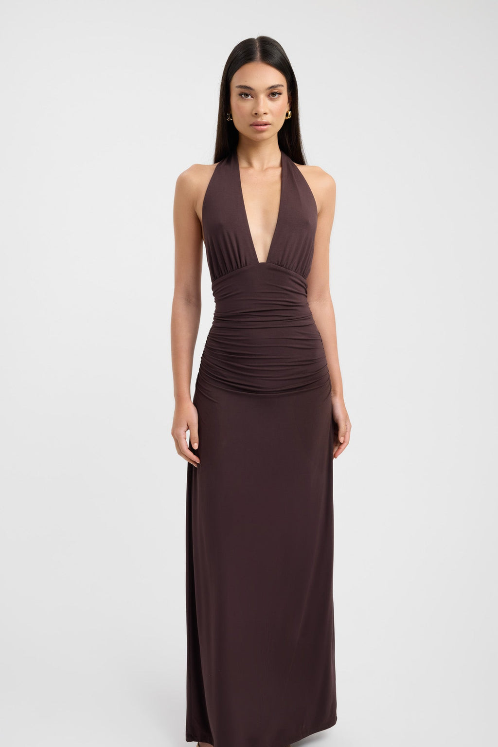 Floor-length dark brown occasion dress with a refined button neckline and fluid silhouette