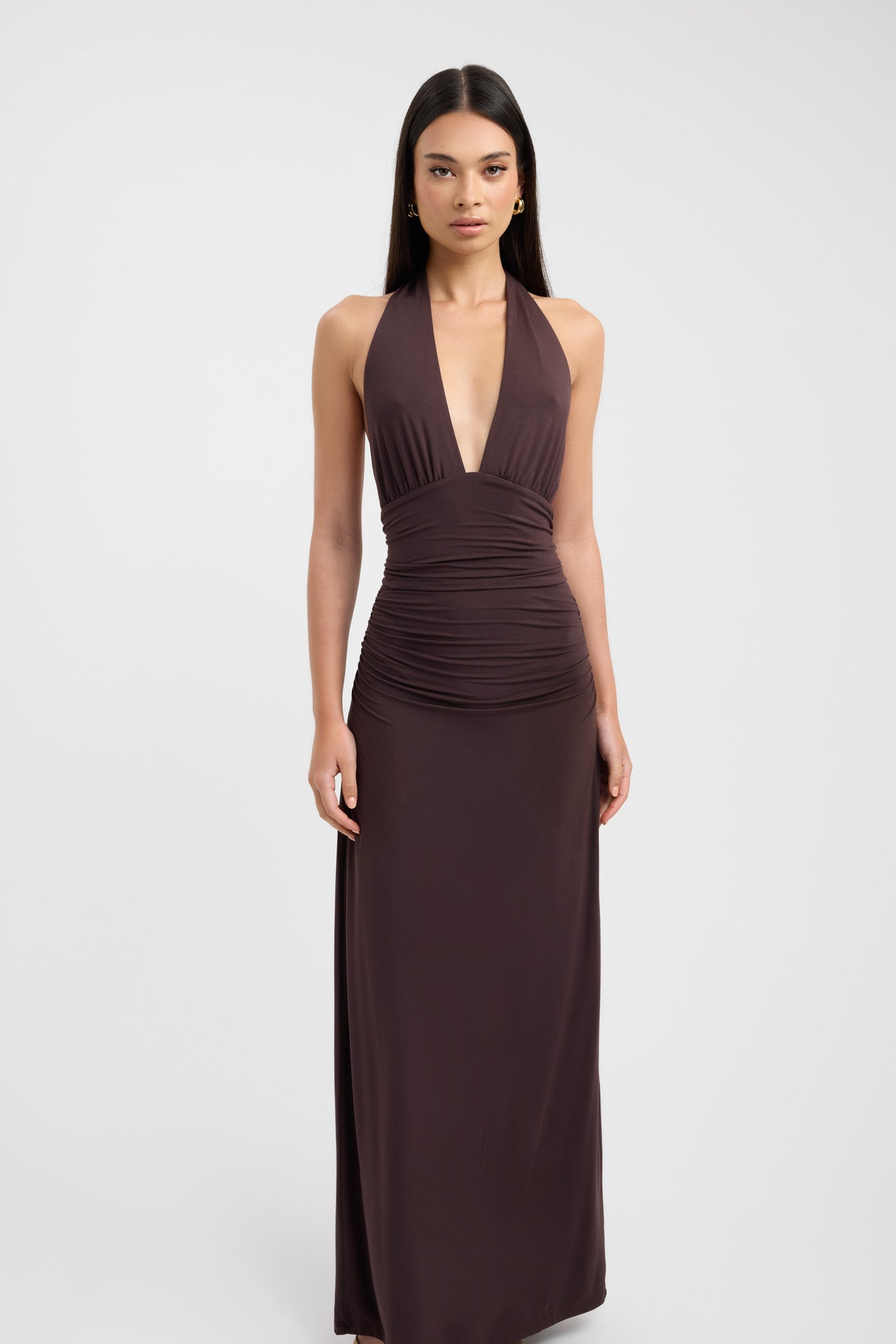 Floor-length dark brown occasion dress with a refined button neckline and fluid silhouette