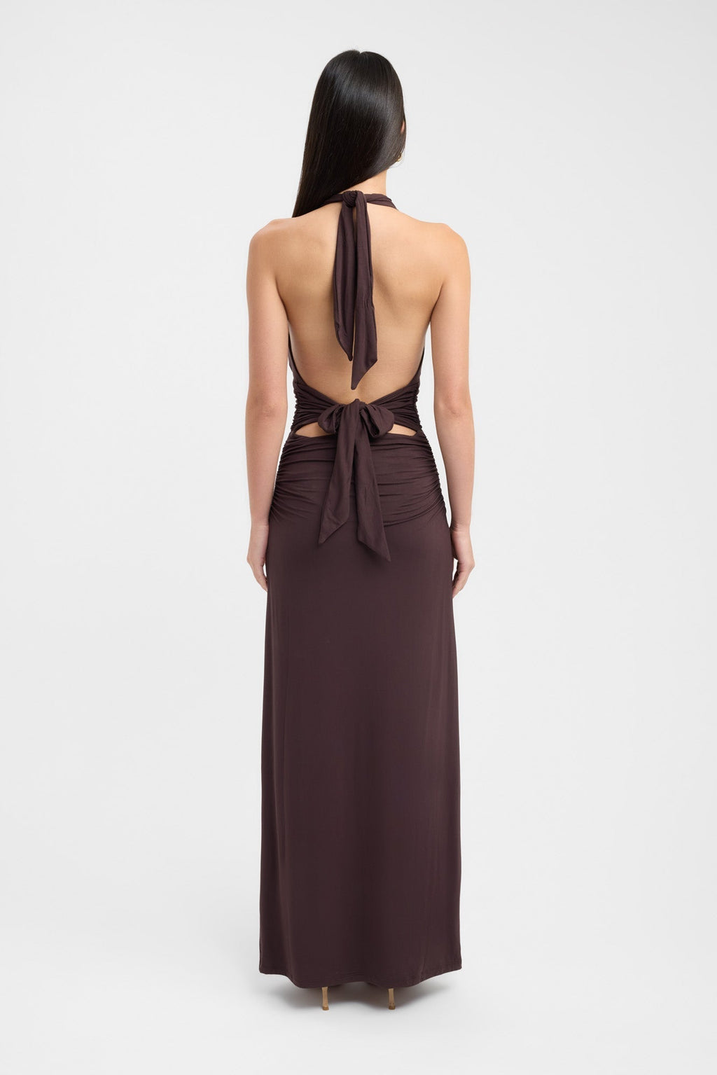 Floor-length dark brown occasion dress with a refined button neckline and fluid silhouette