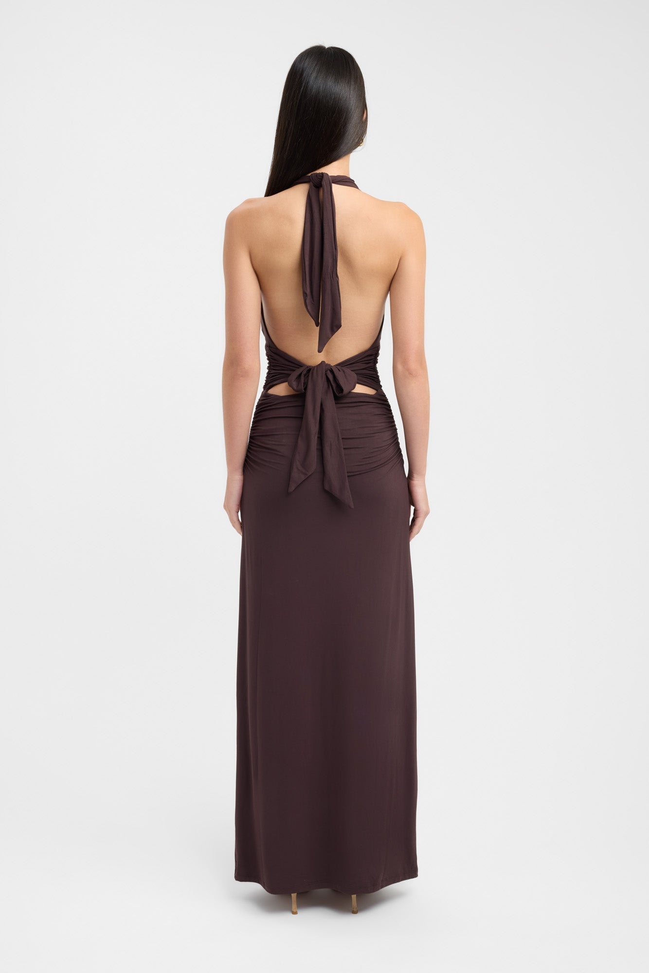 Floor-length dark brown occasion dress with a refined button neckline and fluid silhouette