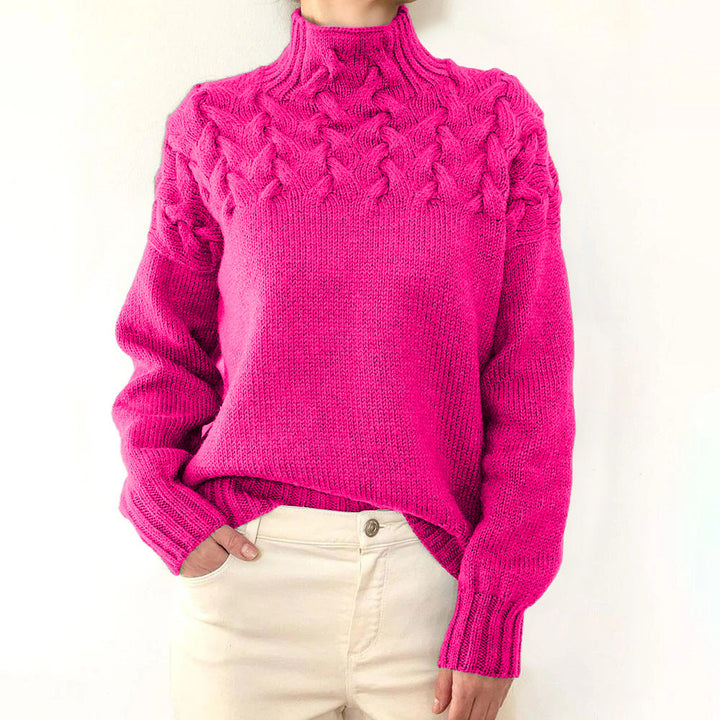 A woman wearing a warm roll-neck jumper, cosy and elegant on a cold winter day.