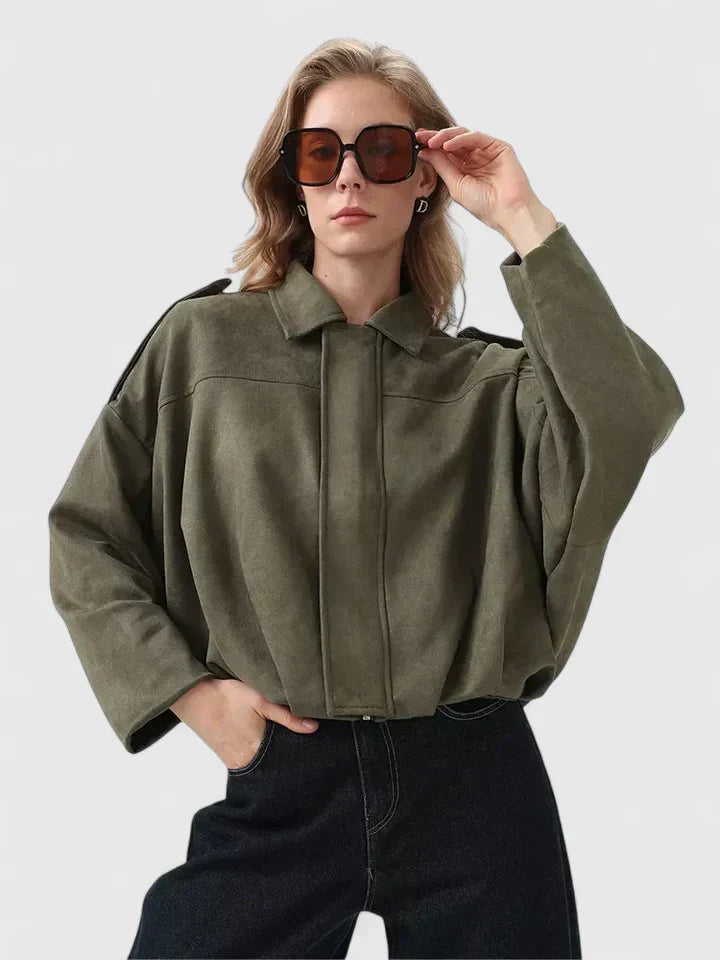 A woman wearing a classic versatile jacket, styled for a smart-casual day out.