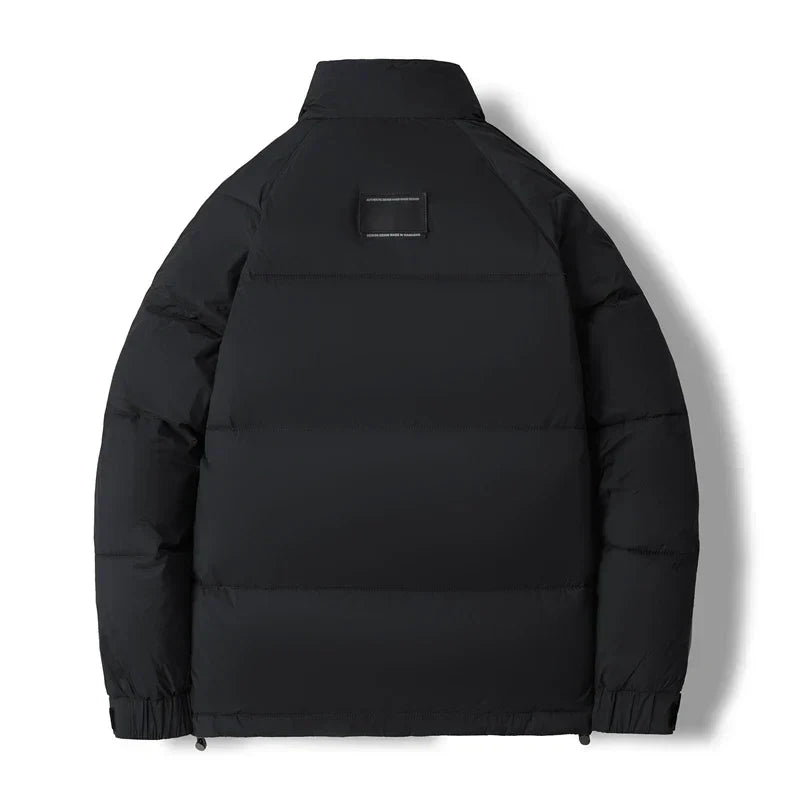 Men's grey structured quilted jacket with high collar and clean urban silhouette