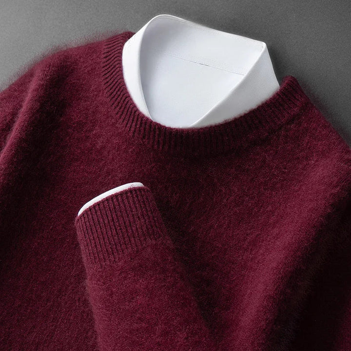A woman wearing a soft warm jumper layered over a shirt on a cold day.
