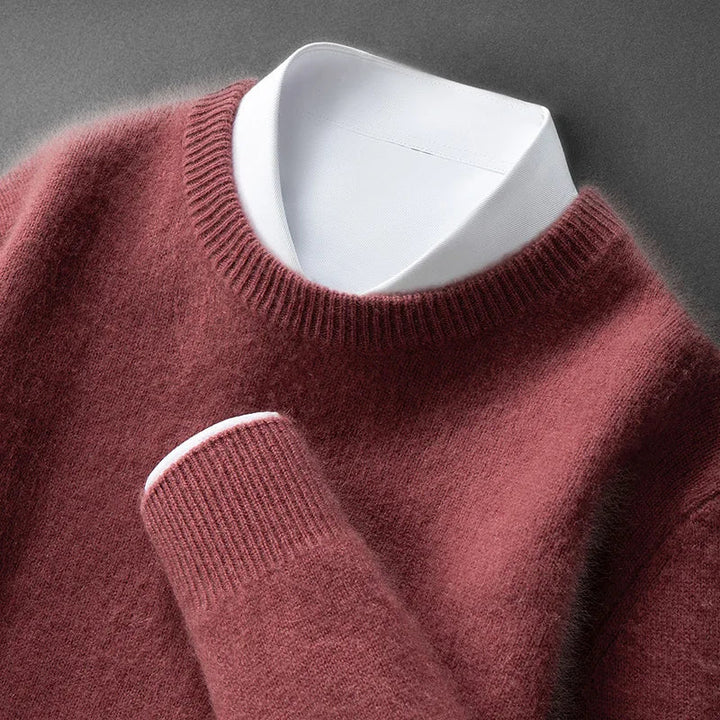 A woman wearing a soft warm jumper layered over a shirt on a cold day.