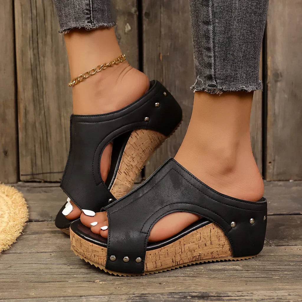Backless wedge sandals with open-work upper in a natural beige tone