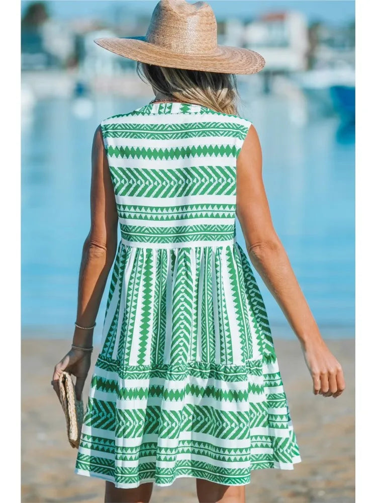 Woman in a geometric print A-line summer dress enjoying a sunny day out.