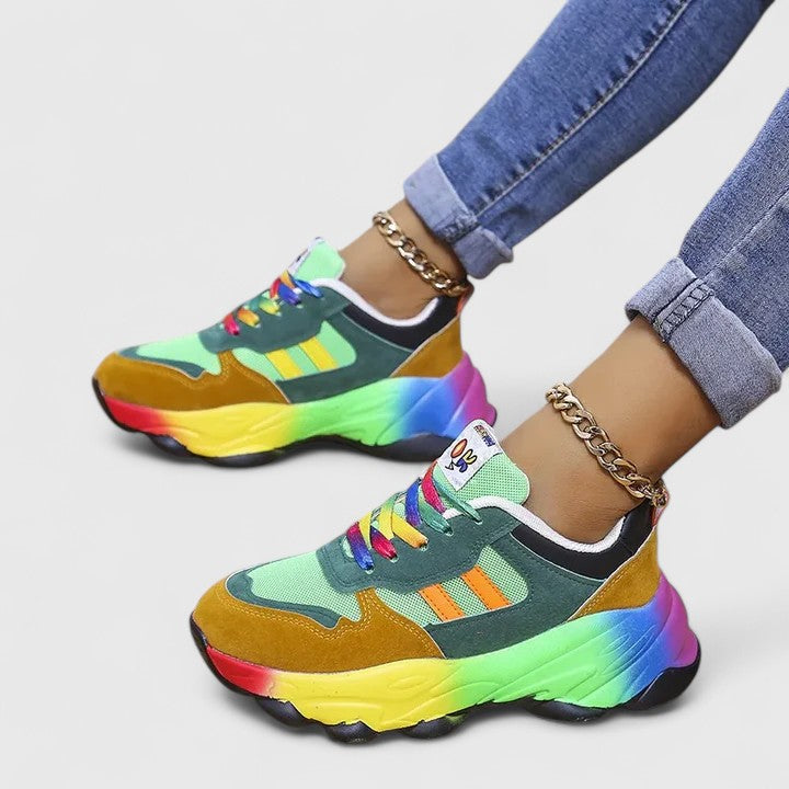 A woman wearing colourful cushioned orthopaedic lace-up shoes