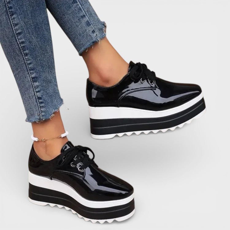 Women's platform trainers in beige with a cushioned sole and glossy contemporary finish