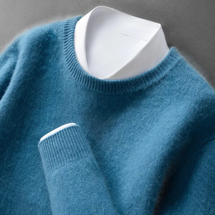 A woman wearing a soft warm jumper layered over a shirt on a cold day.