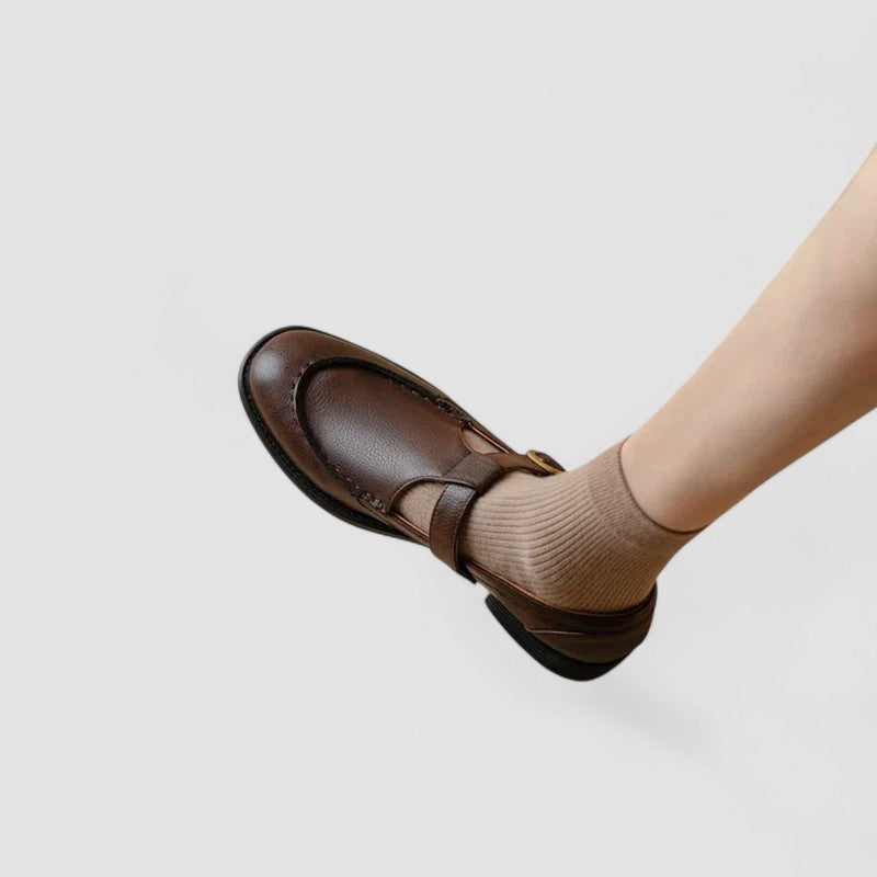 A woman in black round-toe Mary Jane shoes, comfortable and classic at the office.