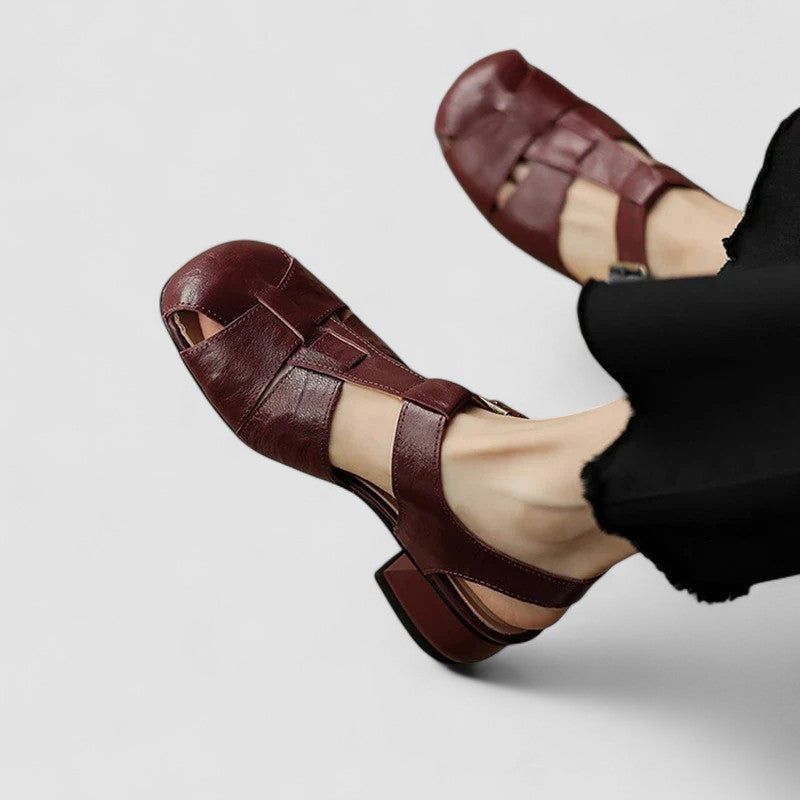 A woman in beige Mary Jane shoes with an ankle strap, comfortable browsing a market.
