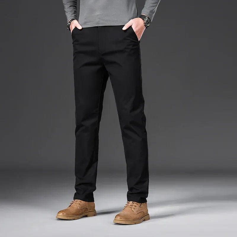 Men's casual trousers in black, blue, dark grey and beige with a relaxed, clean silhouette