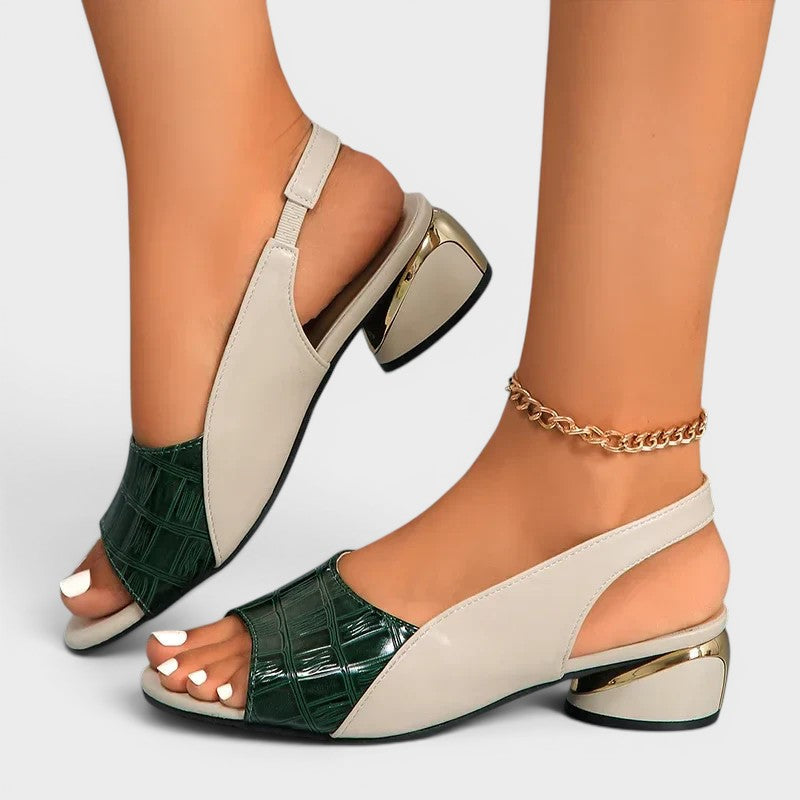 Women's peep-toe wedge sandals in red with an open toe and secure ankle strap