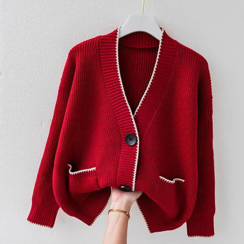 Oversized braided cardigan in beige, orange and navy blue with a relaxed open-front silhouette