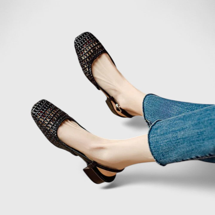 A woman wearing woven ballet flats with a square toe on an easy day out.