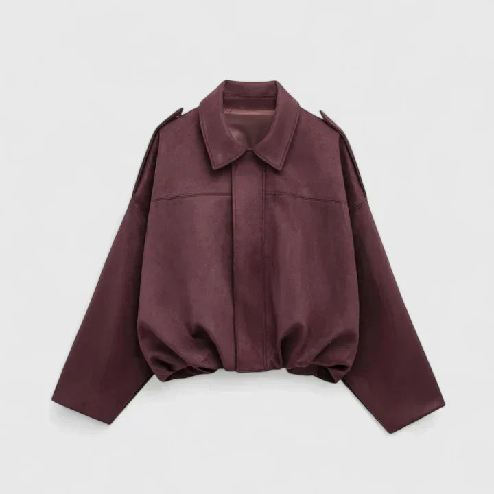 A woman wearing a classic versatile jacket, styled for a smart-casual day out.