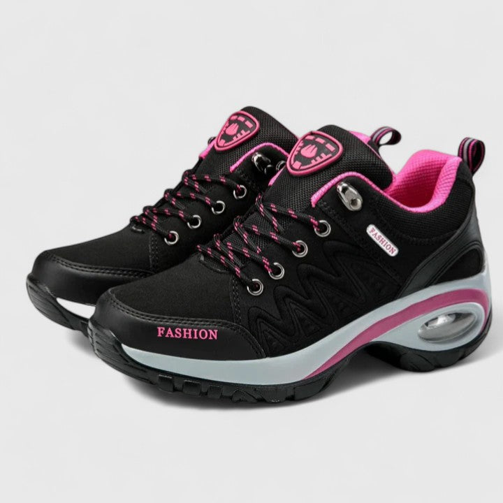A woman wearing water-resistant comfort trainers on a wet winter day