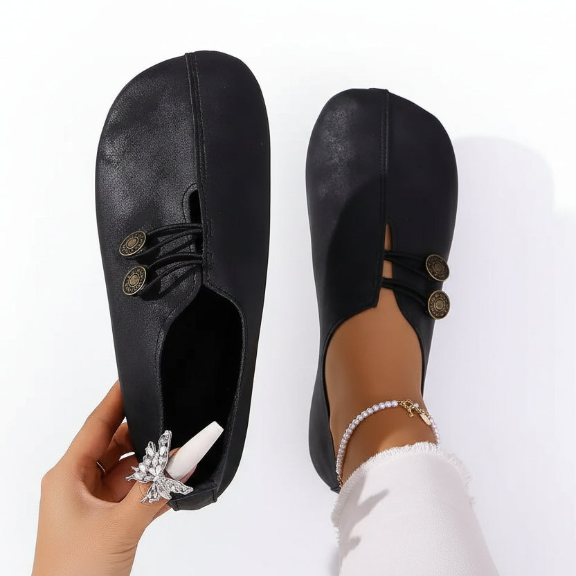 Women's wide-fit comfort trainers in black with a cushioned sole and elastic closure