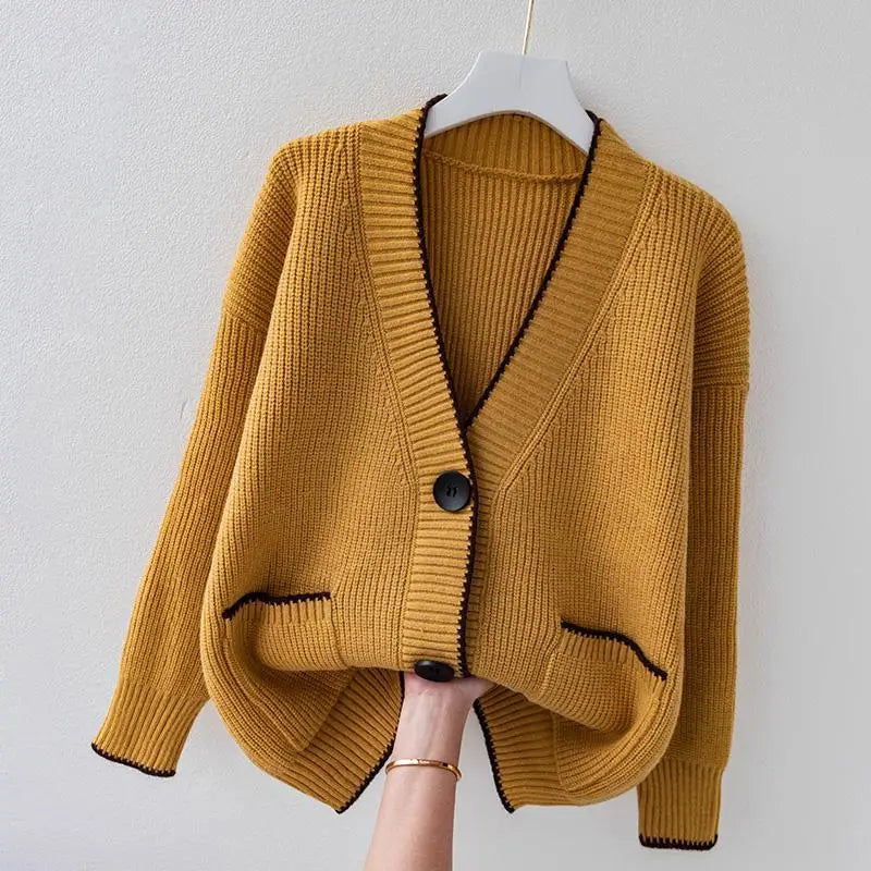 Oversized braided cardigan in beige, orange and navy blue with a relaxed open-front silhouette