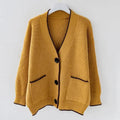 Oversized braided cardigan in beige, orange and navy blue with a relaxed open-front silhouette