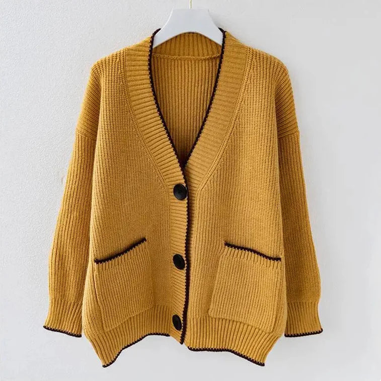 Oversized braided cardigan in beige, orange and navy blue with a relaxed open-front silhouette