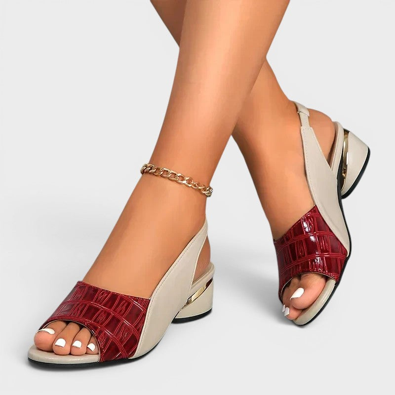 Women's peep-toe wedge sandals in red with an open toe and secure ankle strap