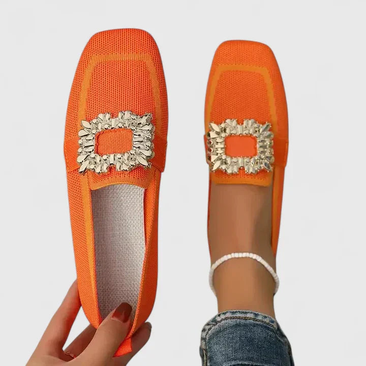 A woman relaxing at home in soft supportive house slippers