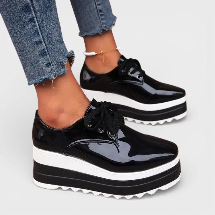 Women's platform trainers in beige with a cushioned sole and glossy contemporary finish