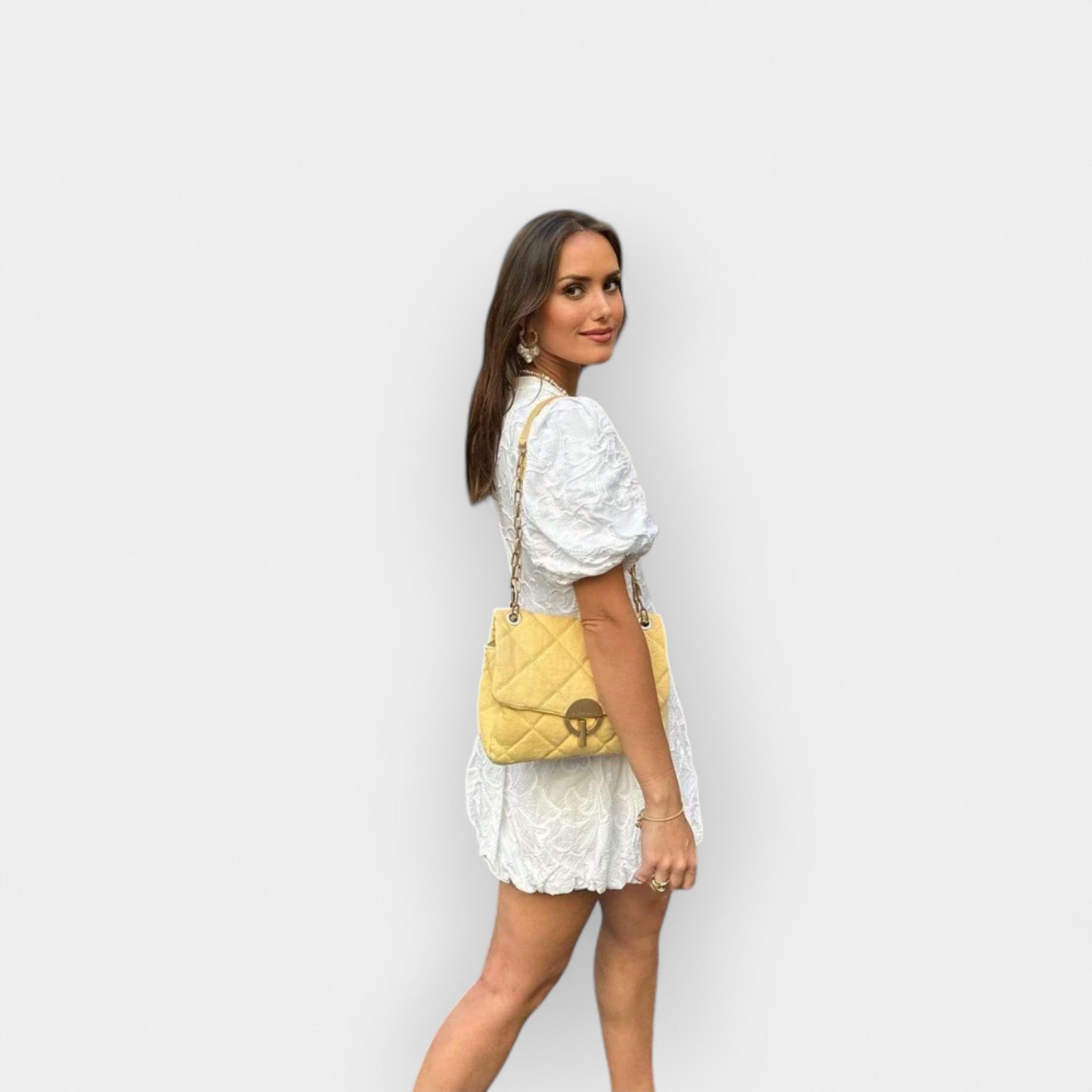 Flowing white summer dress with a soft romantic silhouette and gentle movement