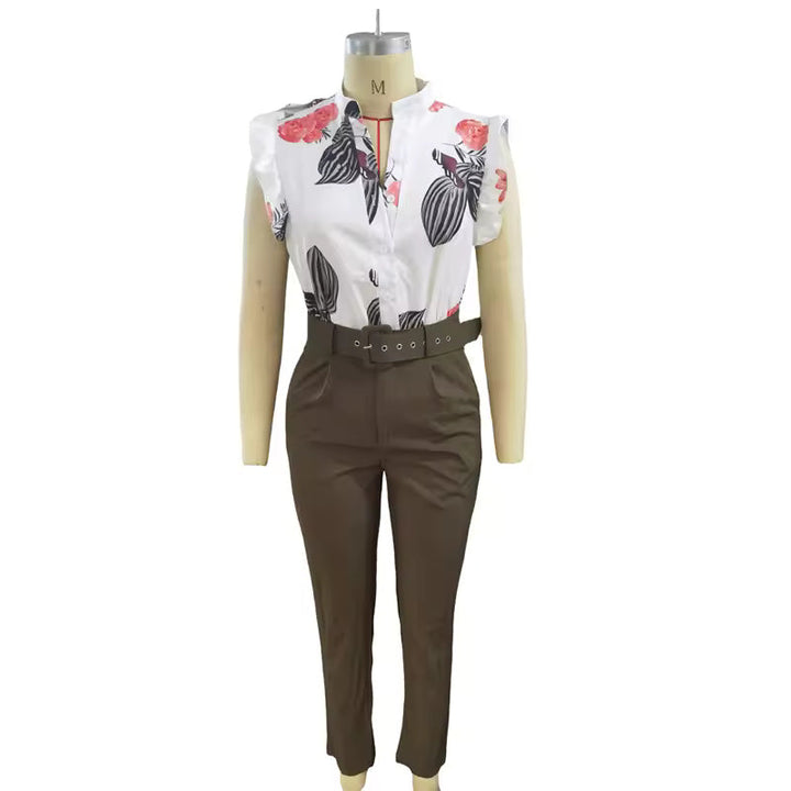 A woman wearing a floral ruffle-sleeve top with high-waisted trousers, elegant and striking.